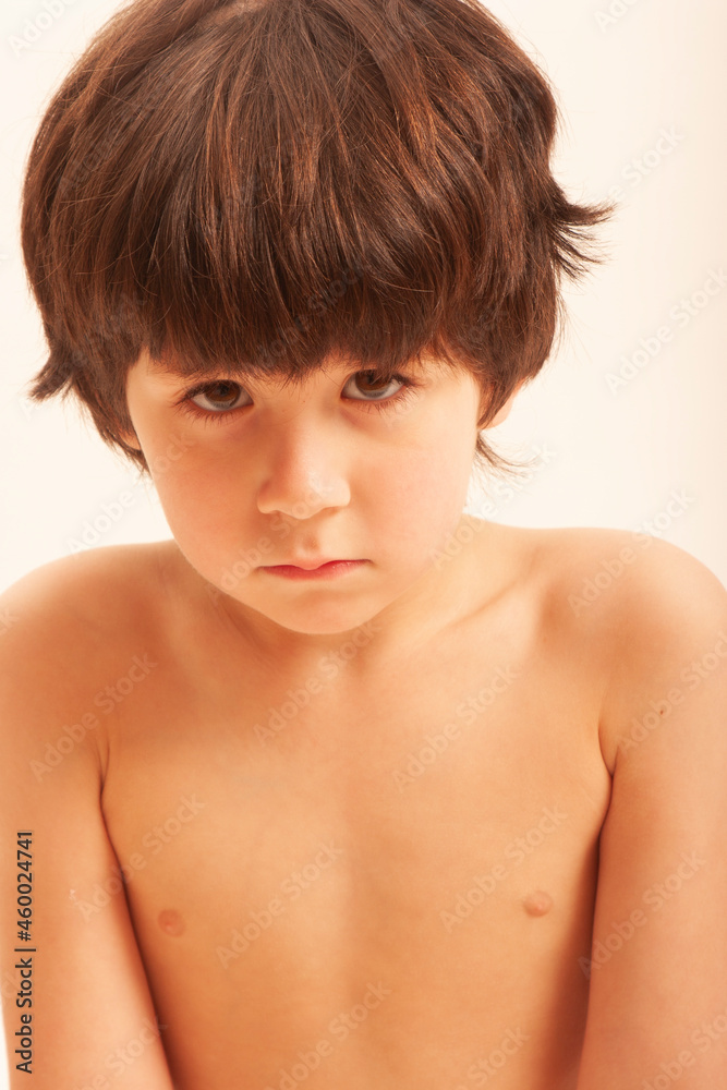 portrait of sad boy child looking at camera portrait of sad boy child looking at camera
