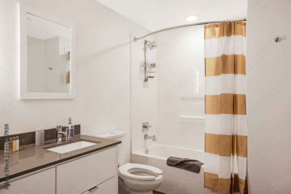 Bathroom with bathtub and shower in new hotel