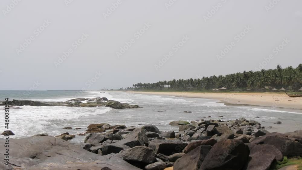 Wide shot of waves crashing onto beautiful and remote Sunset Beach near Buchanan, Liberia Wide shot of waves crashing onto beautiful and remote Sunset Beach near Buchanan, Liberia