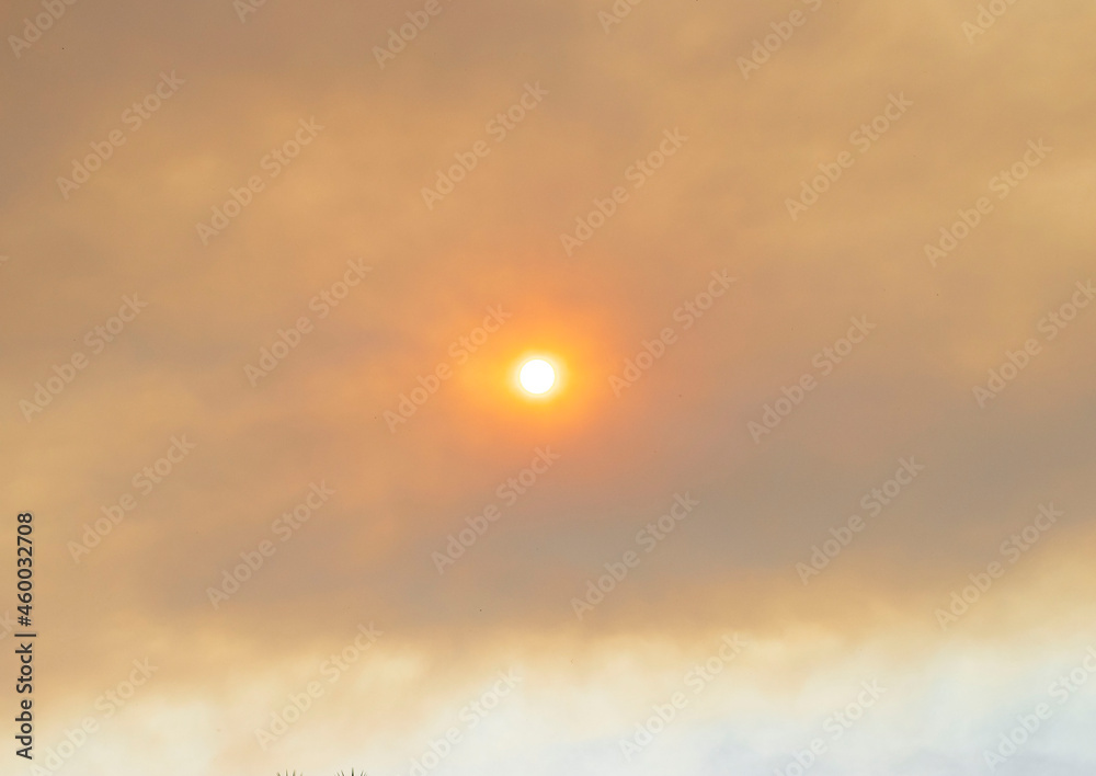 sun covered by smog from fire