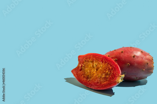 Photography Prickly pear fruit on blue background with copy space.