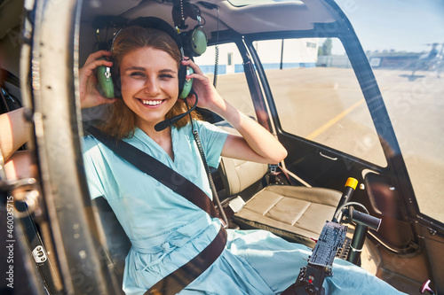 Pleased Caucasian airwoman getting ready for flight