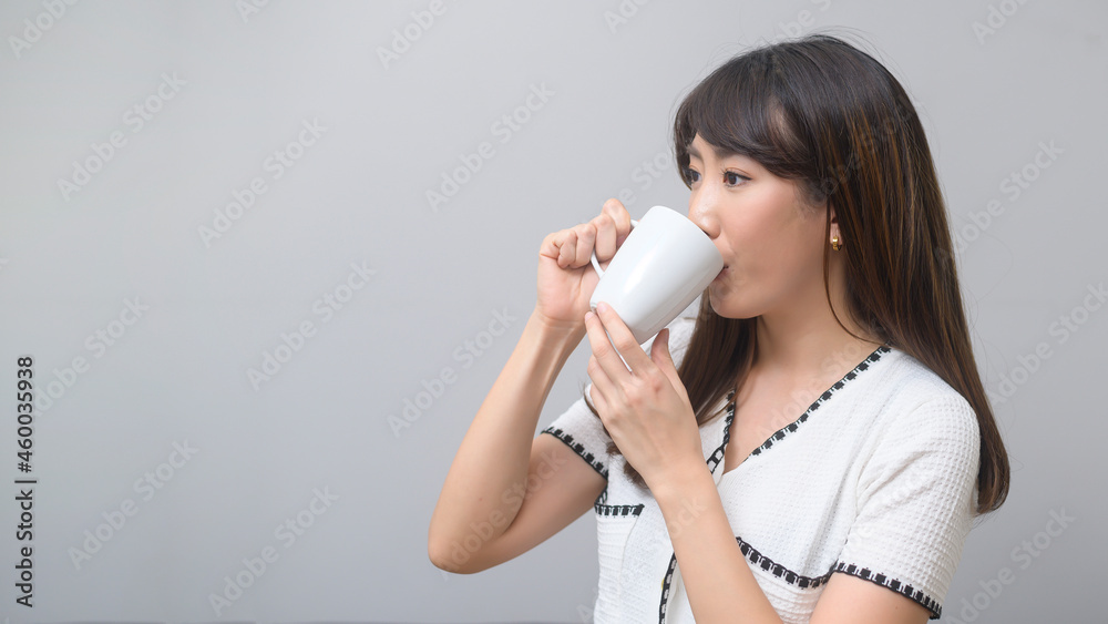 Portrait of young beautiful woman having a cup of coffee Portrait of young beautiful woman having a cup of coffee