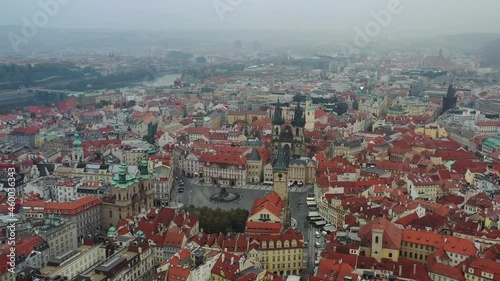 Wallpaper Mural Aerial cinematic view of Church of Our Lady and easter market in Prague.  Cathedral, main square with illuminated street shop in old town. Misty day. Picturesque cityscape in autumn Torontodigital.ca