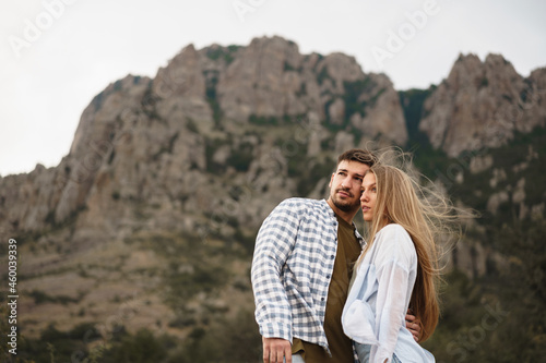 Happy loving couple hiking and hugging in mountains © fotofabrika