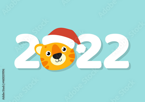 Gift color greeting card. Tiger simbol in a santa hat. Cute cartoon character. Happy New Year and Merry Christmas. Flat style. Vector illustration. photo