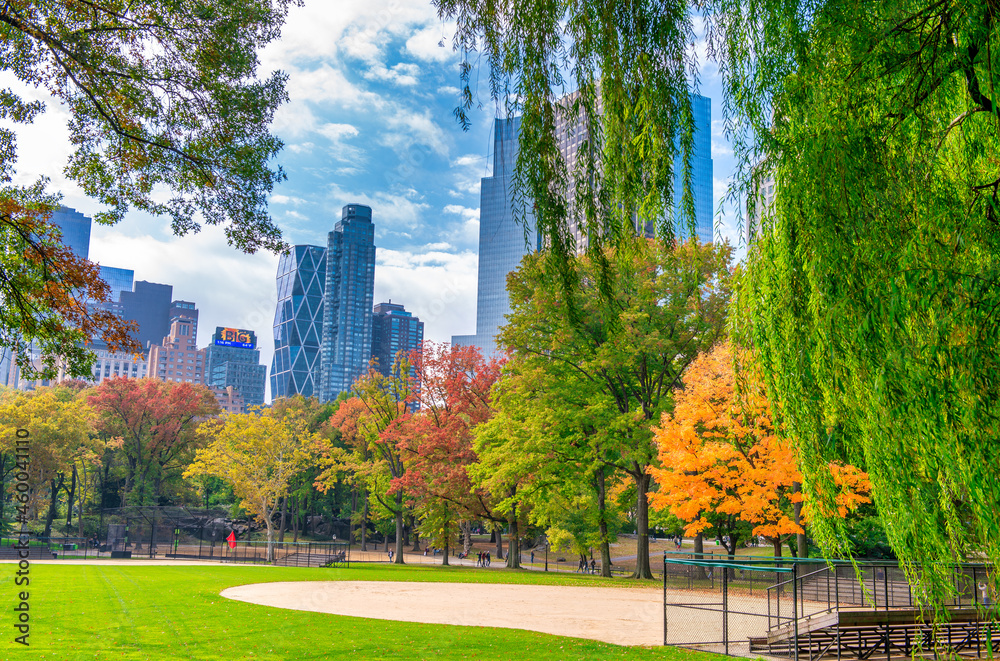 NEW YORK CITY, USA - OCTOBER 25TH, 2015: Foliage colors of Central Park in autumn season. It is a main city attraction. NEW YORK CITY, USA - OCTOBER 25TH, 2015: Foliage colors of Central Park in autumn season. It is a main city attraction.