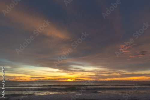 the colorful clouds are changing color in sky at sunset above the sea..Gradient color. Sky texture, abstract nature background..Sunset with strong color clouds at Karon beach Phuket. © Narong Niemhom