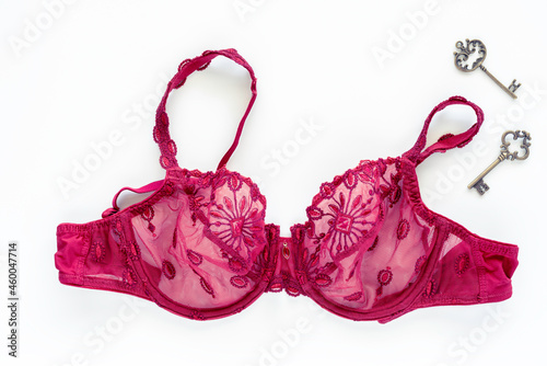 Red lace bra on white background.