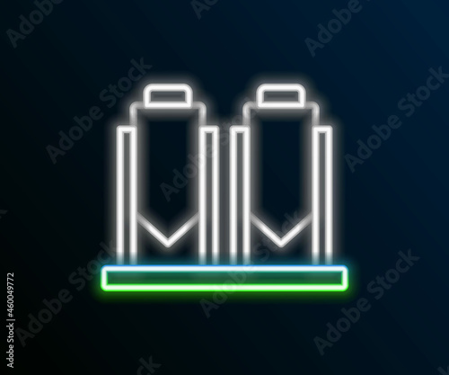 Glowing neon line Traditional brewing vessels in brewery icon isolated on black background. Beer brewing process. Distillery plant, brewery. Colorful outline concept. Vector