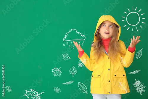 Cute little girl in raincoa...
