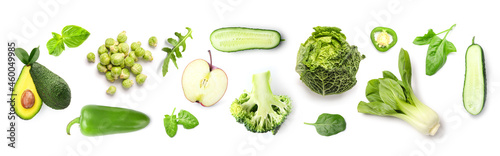 Set of green vegetables and herbs on white background