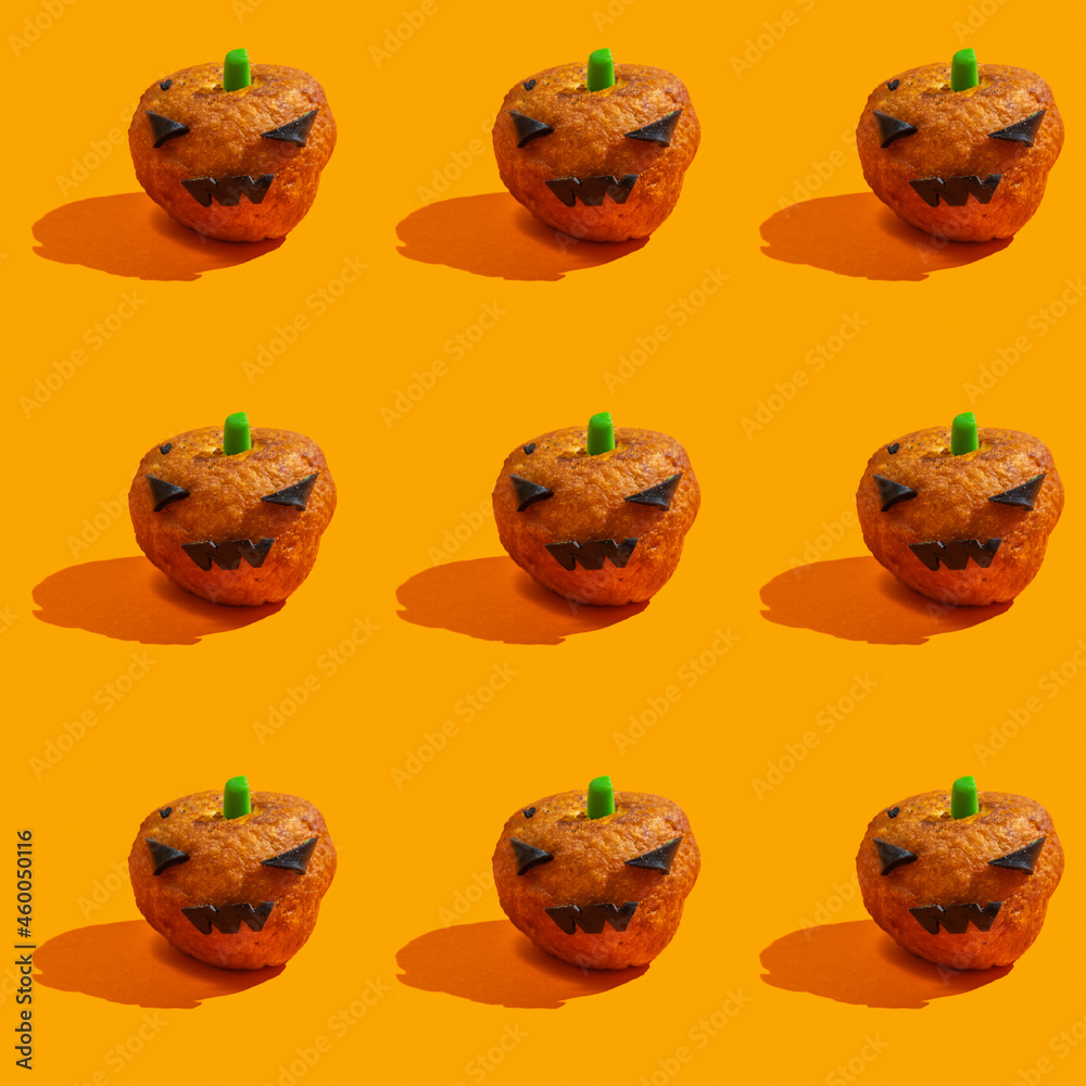 Seamless pattern with fun Halloween food. Halloween pumpkin donut on orange background. Seamless pattern with fun Halloween food. Halloween pumpkin donut on orange background.