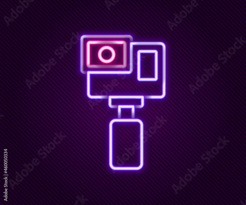 Glowing neon line Action extreme camera icon isolated on black background. Video camera equipment for filming extreme sports. Colorful outline concept. Vector