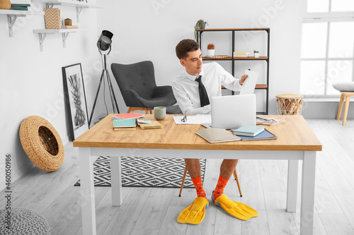 Young businessman with padd...
