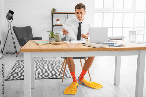 Young businessman with padd...