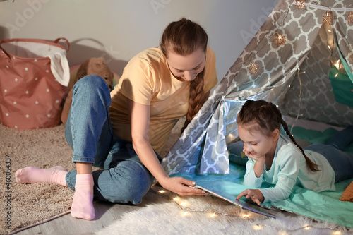 Young woman reading fairy-t...