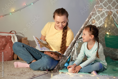 Young woman reading fairy-t...