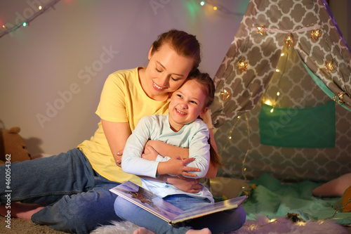 Young woman hugging her lit...