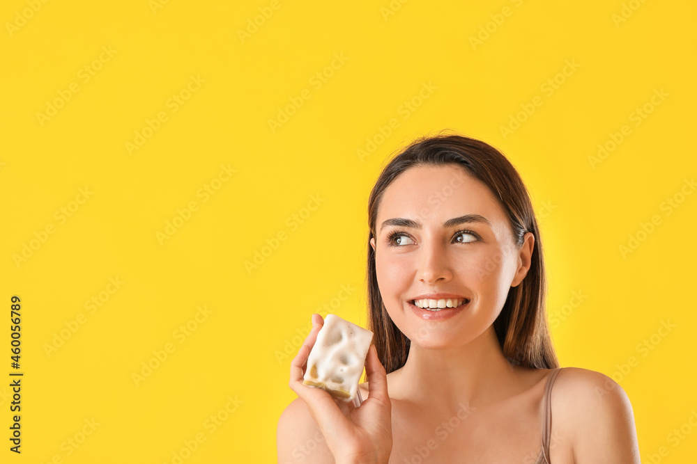 Beautiful young woman with soap on color background Beautiful young woman with soap on color background