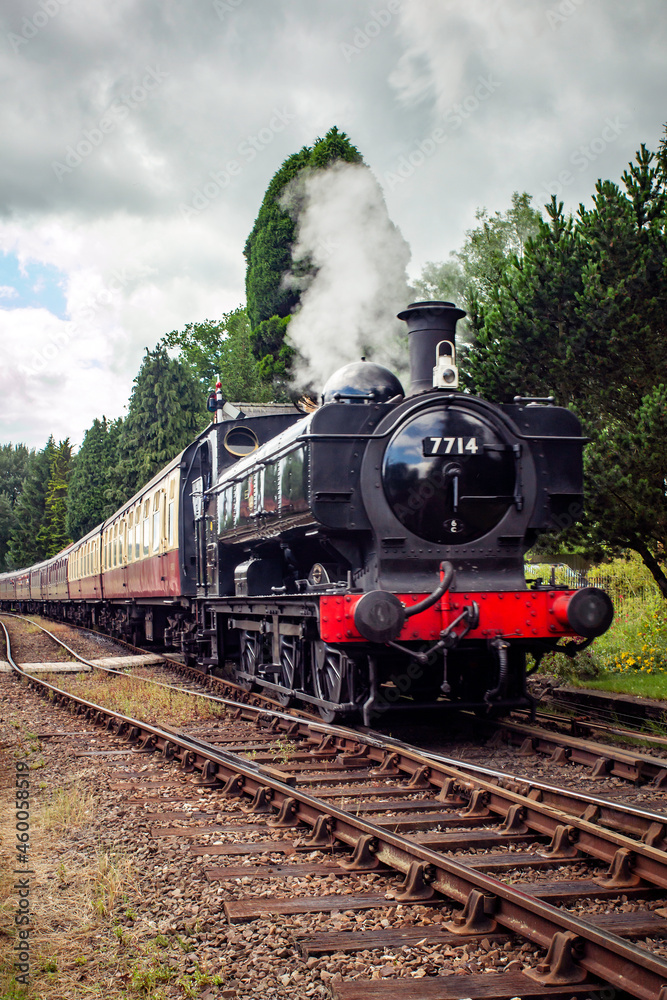GWR Pannier tank locomotive hauling a rake of carriages GWR Pannier tank locomotive hauling a rake of carriages