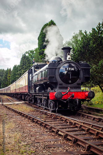 GWR Pannier tank locomotive hauling a rake of carriages