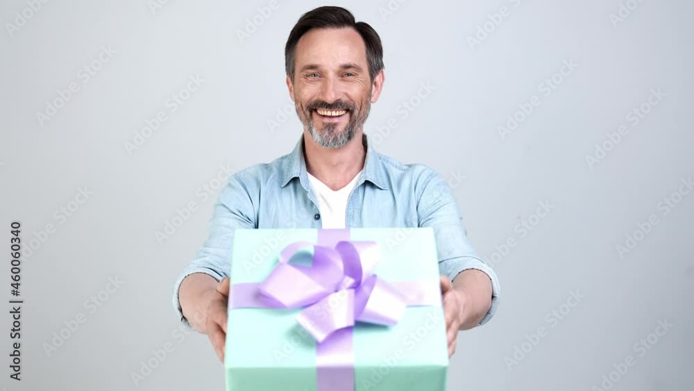 Cheerful courier man prepare gift box delivery Cheerful courier man prepare gift box delivery