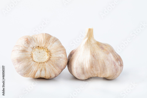 Raw whole garlic isolated on white background. Full depth of field. Concept healthy lifestyle.