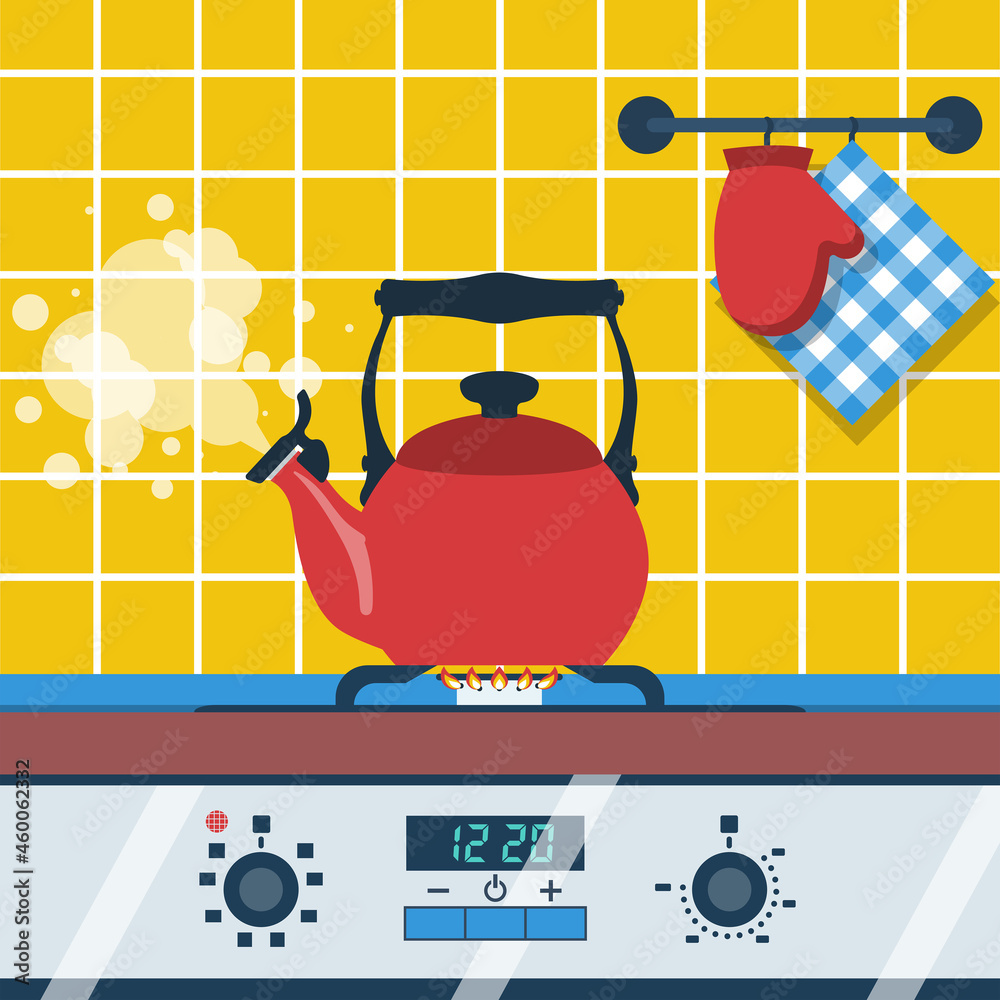 Boiling kettle with steam on a gas stove. Kettle and dishes in the