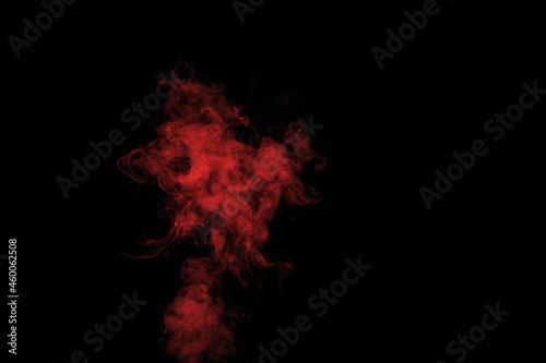 Colored red steam, smoke on a black background to superimpose on your photos. Yellow-orange smoke, steam, aroma. Create mystical Halloween photos. Abstract background, design element