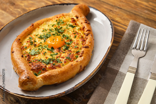 Wallpaper Mural Plate with tasty Ajarian khachapuri on wooden background Torontodigital.ca