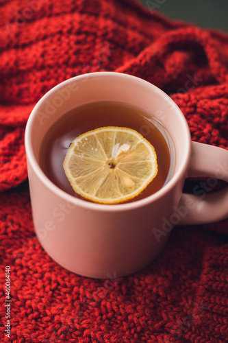 A cup of hot tea with lemon. Warming autumn drink. Autumn