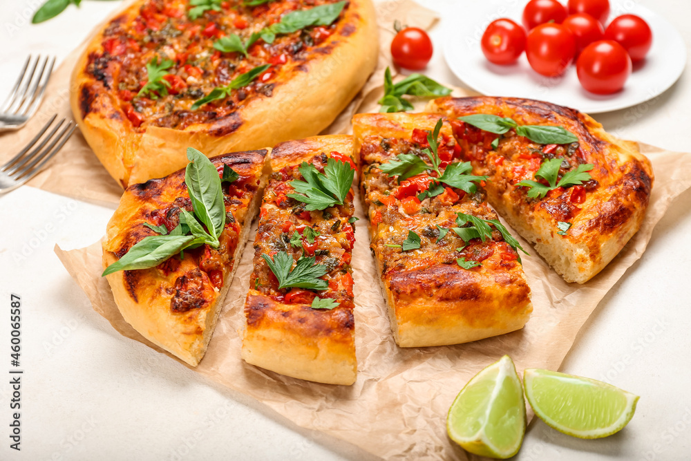 Tasty sliced Turkish Pizza on white background Tasty sliced Turkish Pizza on white background