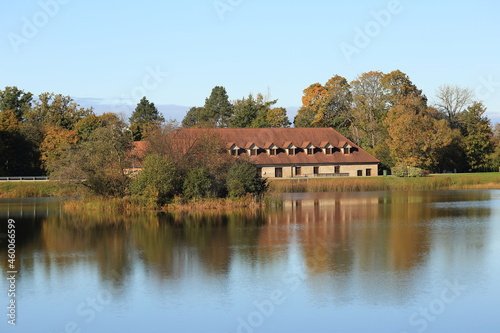 Reflection of trees and architecture in the lake. indian summer in Europe. High quality photo photo