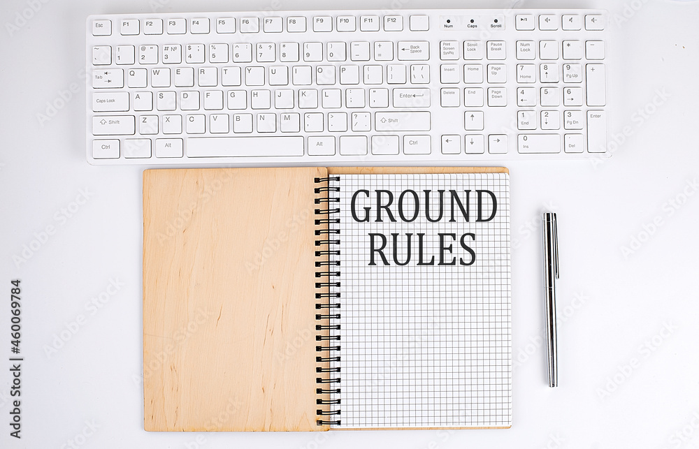 GROUND RULES text on the notebook with keyboard on the white background