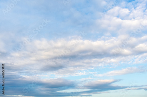 Blue sky and clouds of pastel colors