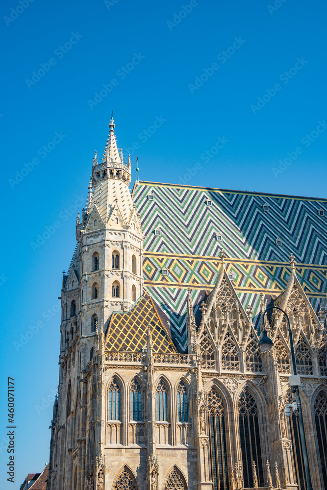 Famous iconic Stephan Cathedral at sunset colors and blue sky in historical touristic downtown of Vienna, Austria.