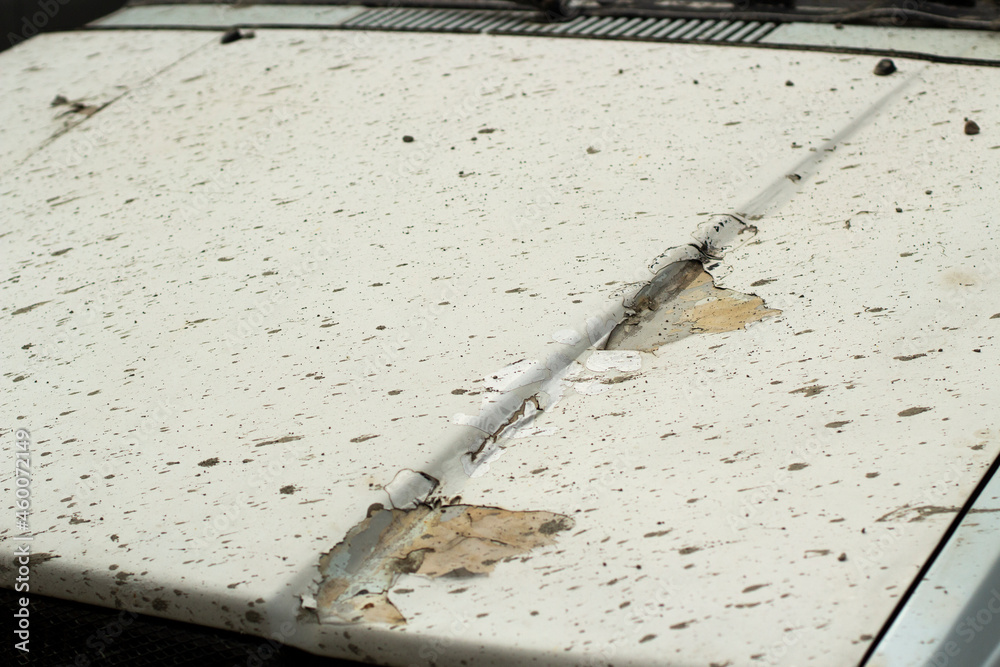 Spoiled paint on the car. The hood of the car after a long storage
