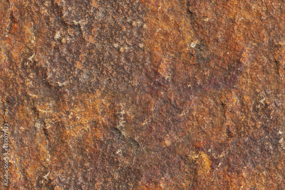 Brown stone rough seamless texture surface with orange inclusions macro Brown stone rough seamless texture surface with orange inclusions macro