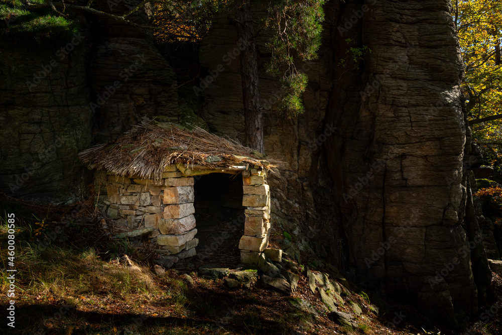 Small stone hut in the middle of a forest