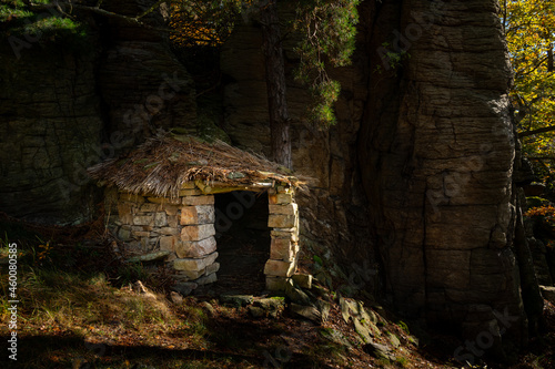 Small stone hut in the middle of a forest