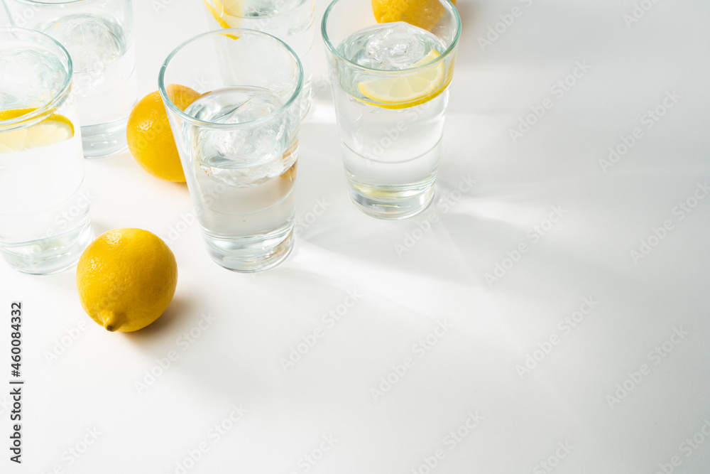 Water glasses background - copy space water in glasses with ice and citrons Water glasses background - copy space water in glasses with ice and citrons