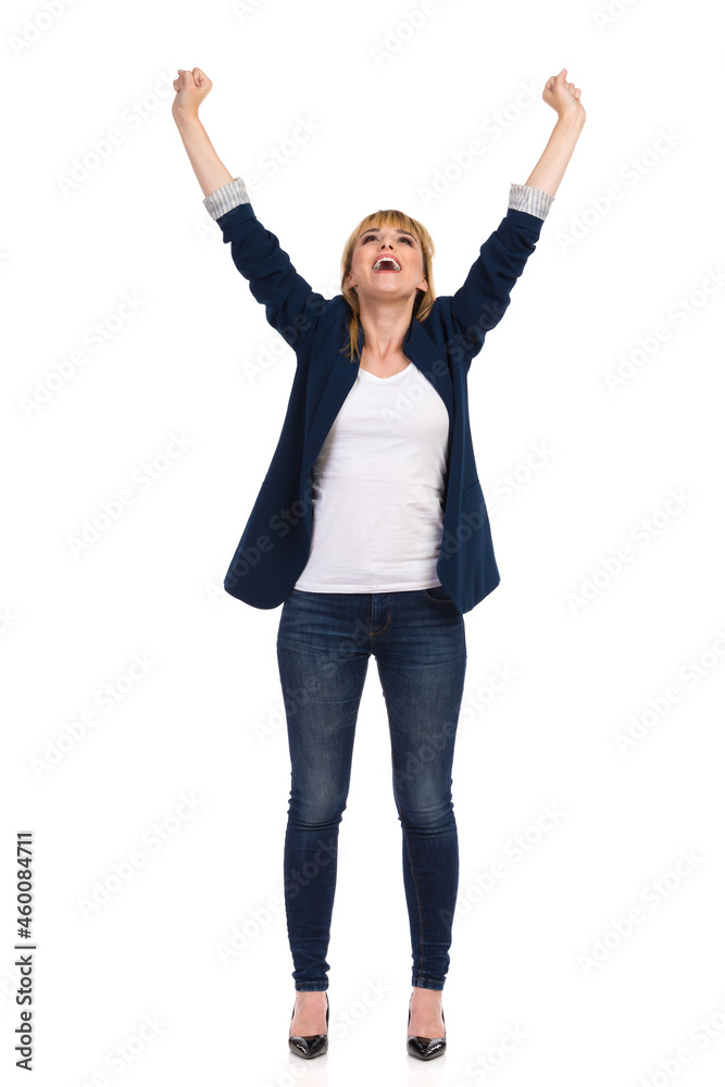 Carefree And Happy Female Office Worker Is Standing With Arms Raised And Shouting. Front View. Carefree And Happy Female Office Worker Is Standing With Arms Raised And Shouting. Front View.