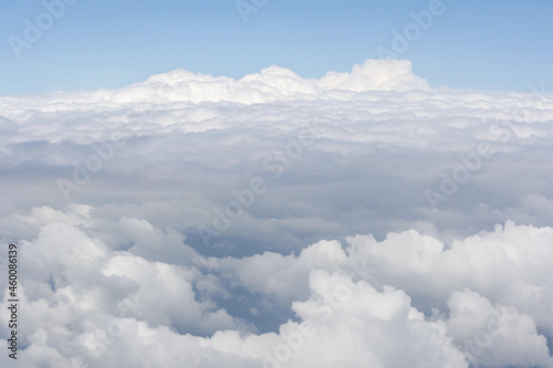 Fototapeta Naklejka Na Ścianę i Meble -  View from high altitude of fluffy and soft white cloud texture pattern like cotton, foam or snow. Use for wallpaper, background or backdrop. No people. Copy space. 