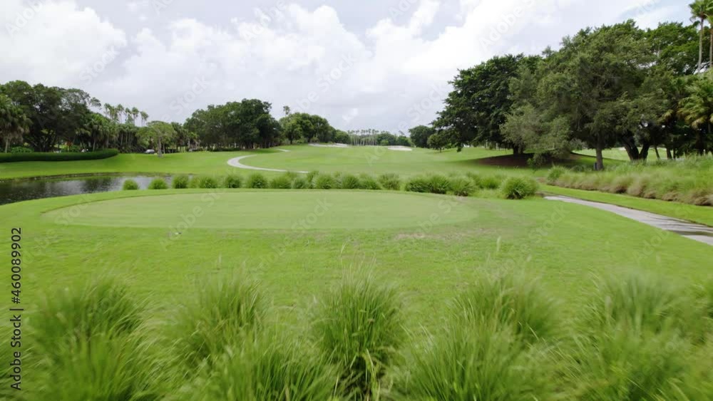 Aerial drone view low over bush and grass fields on a golf course in Weston, Florida Aerial drone view low over bush and grass fields on a golf course in Weston, Florida