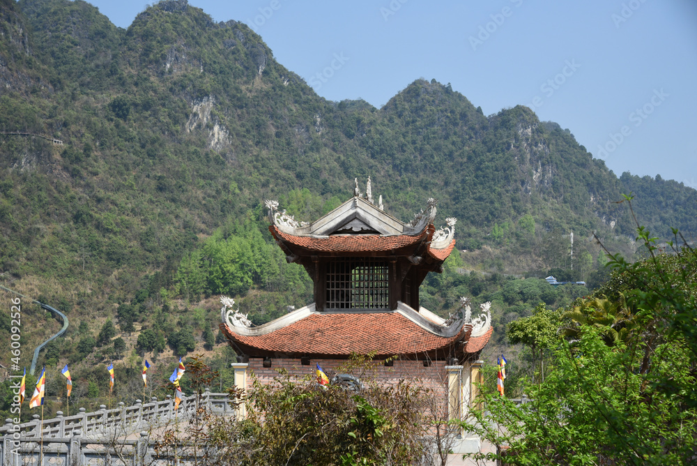 Pagoda on the territory of a Buddhist temple against the backdrop of mountains on a sunny day Pagoda on the territory of a Buddhist temple against the backdrop of mountains on a sunny day