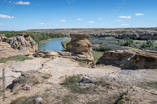 Rock formations on the edge of the Milk River in Writing on Stone Provincial Park in Alberta, Canada photo