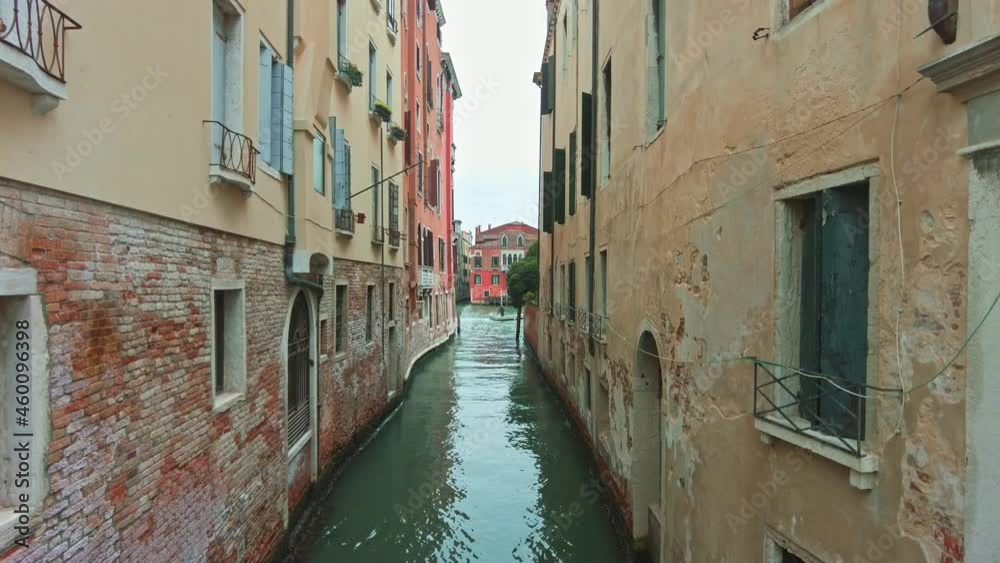 Boats through the canals of Venice, Italy. A summer day in Venezia, Italia. Famous old buildings and architecture. Boats through the canals of Venice, Italy. A summer day in Venezia, Italia. Famous old buildings and architecture.