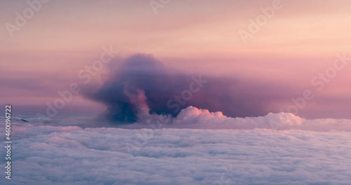 sunset day to night time lapse of Volcanic ash cloud and sea of clouds in La Palma Island during volcano cumbre vieja eruption in September 2021 photo