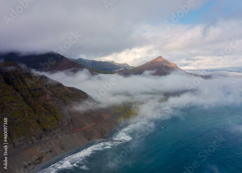 Aerial view on Iceland mountains peaks covered in clouds